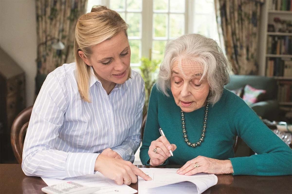 mother and daughter looking a finances