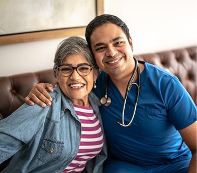 male nurse and senior woman smiling
